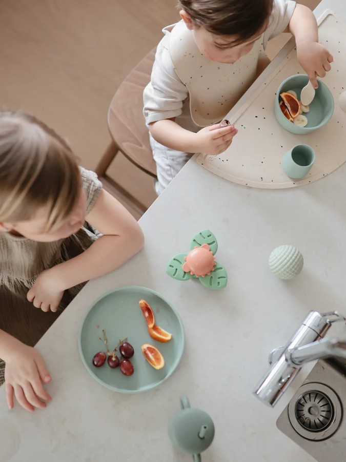 Mushie - spinner sensoryczny z przyssawką Dino