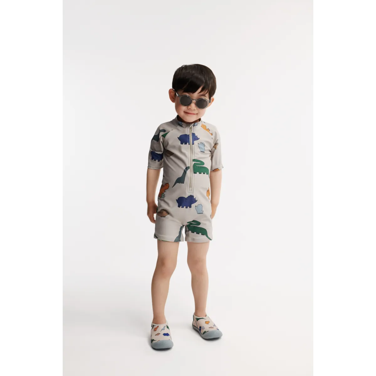 Liewood - kombinezon kąpielowy z krótkim rękawem UV Max Printed dinosaurs mist
